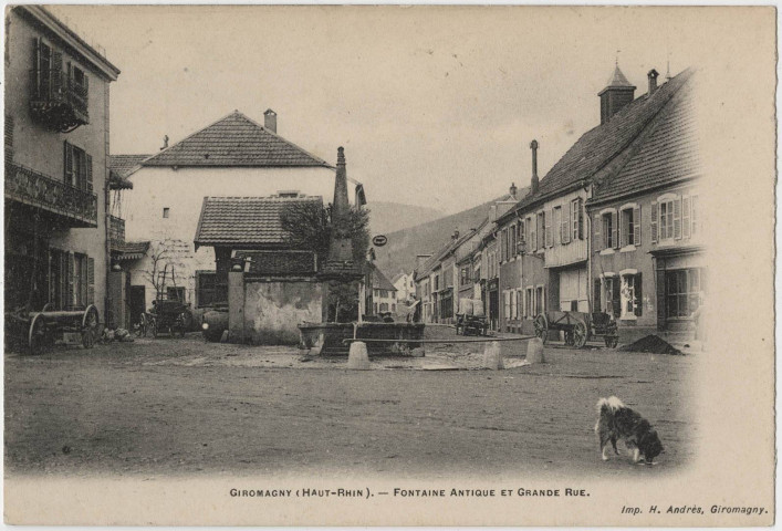Giromagny (Haut-Rhin), fontaine antique et Grande Rue.