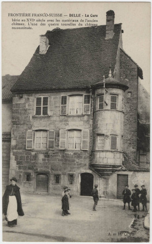 Frontière Franco-Suisse, Delle, la cure, bâtie au XVIe siècle avec les matériaux de l'ancien château. L'une des quatre tourelles du château reconstituée.